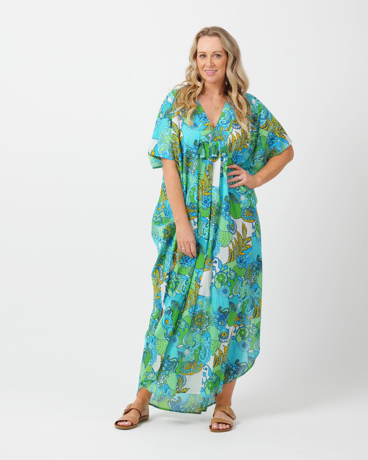 Woman wearing a colorful dress with a white background